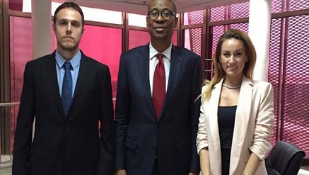Okechukwu Enelamah (middle), minister of Industry and Trade flanked by visitors from Oxford Business Group (OBG) in his office recently.